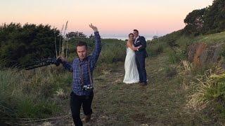 Hilarious wedding photographer making couple laugh