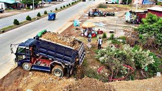 Wonderful dump truck pouring soil filling and Komatsu Bulldozer pushing