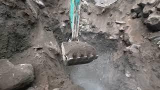 Excavators dig very hard sand