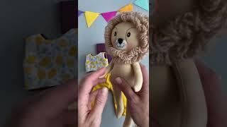 Handmade soft toy lion for children. Textile dolls