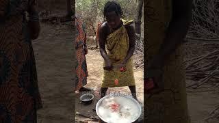 Hadzabe tribe women preparing meals in the bush for the tribe