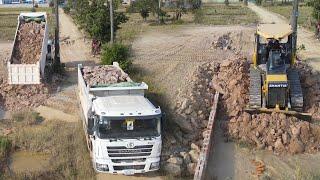 Extremely Technology Bulldozer strong moving Dirt to filling with huge Dump Truck in action