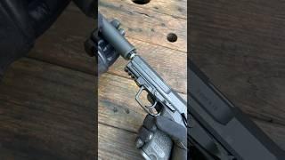 USP 9 Tactical suppressed