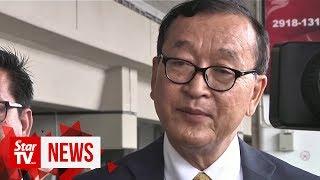 Cambodian opposition figure Sam Rainsy arrives in Jakarta