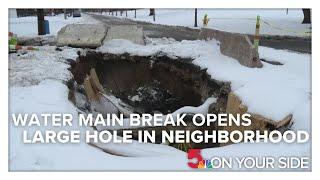 Water main break opens large hole in Hyde Park neighborhood