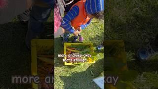 Kids spray vegetables clean at Wyck House farm club #farm #kids #veggrowing