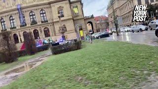 Panicked students seen huddling on ledge as at least 15 killed in shooting at university in Prague