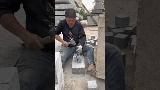 One hammer, one chisel — one granite cube cobble stone at a time. Can you guess where these end up?