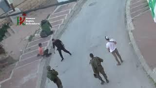 Occupation soldiers and armed settlers humiliated Palestinians in Hebron