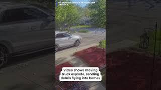 Video shows a moving truck exploding as it drives down the road, sending debris everywhere
