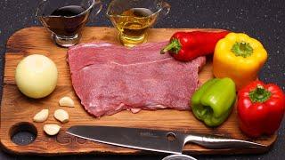 GRILLED MEAT with VEGGIES on a FRYING PAN.