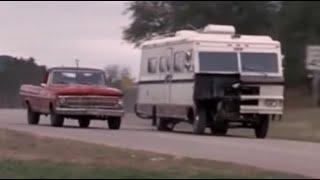 Gang of trucks chase motorhome