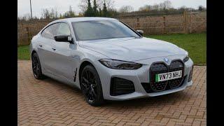 BMW i4 M50 Gran Coupe in Brooklyn Grey with Tacora Red Vernasca Leather