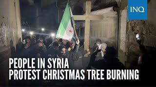 People in Syria protest Christmas tree burning