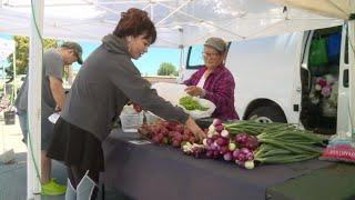 Shopping in the rain? local farmers market with lower turnout due to rain, new location