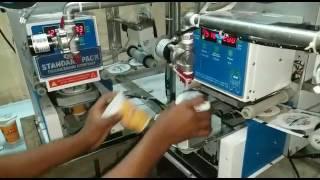 Automatic Juice (Curd) Cup Filling & Sealing Machine-STANDARD PACK ENGINEERING CO., Chennai