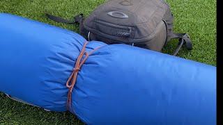 How to tie a sleeping bag to a backpack.