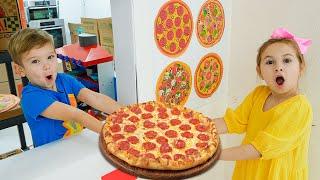 As crianças aprendem a cozinhar pizza e a ajudar umas às outras