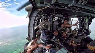 Parachute Jump Into Water From Black Hawk Helicopter