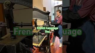 Alex prints a message in French for French Language Day (March 20)