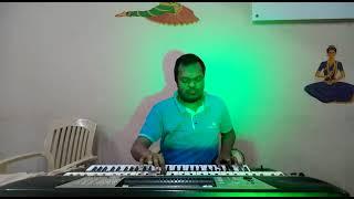 watch talented Ashok Kumar playing a song from kal Ho Na Ho with two keyboards together at a time 