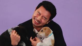 Simu Liu Plays With Puppies While Answering Fan Questions