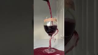 Woman pours wine into a broken wine glass!