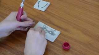 Printmaking with a hand-carved stamp.