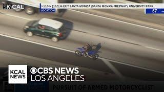 LAPD officers chase allegedly armed motorcyclist in South LA