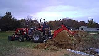 Using the Mahindra backhoe