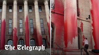 Climate activists spray paint on Finnish parliament building