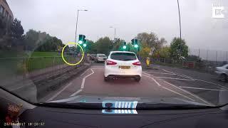 Impatient driver cuts across verge. Video from Caters