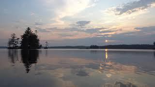 Peaceful Sunrise Over Pristine Lake