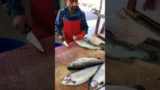 Spectacular cleaning of trout at the fish market