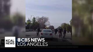 Wild video shows moments teens riding bikes fight back against car that almost hit them