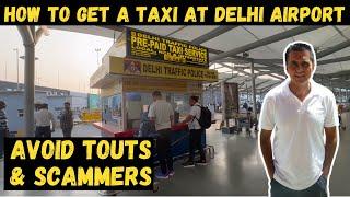 HOW TO GET A TAXI AT DELHI AIRPORT | AVOID THE TAXI TOUTS & SCAMMERS AT DELHI AIRPORT | CATCH A TAXI