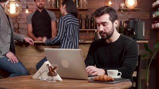 Freelancer In Coffee Shop Stock Video