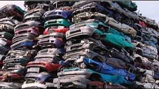 End-of-Life Cars Recycling Process With Car Shredder and Crushing Machines.