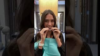 Patient trying on Invisalign at Sealy Dental Center in Katy