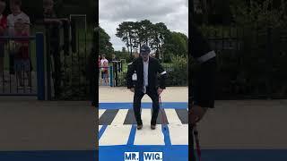 Old Man; Is dancing on top Of a Giant Piano Mr. Wig