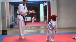 Taekwondo sparring with a 3-year boy