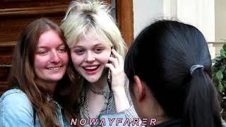 Actress Emily Alyn Lind takes selfies w/ fans while answering a phone call  in Paris