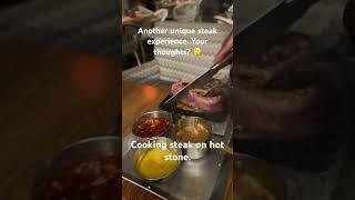 Cooking steak on a hot stone at the table! Your thoughts? #steak #southafrica #food #shorts