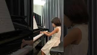 Alisa is performing piano exam grade 2.