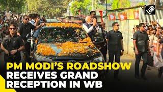 PM Modi holds a roadshow in West Bengal’s Raiganj ahead of LS Polls