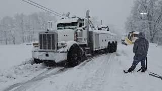 Plow Truck and Other Cars Stuck in Snow in Spring Brook, Pennsylvania