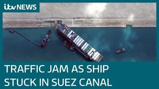 Skyscraper-sized container ship still wedged in Egypt’s Suez Canal | ITV News