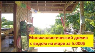 Обзор маленького деревянного домика в Филиппинской деревне.
