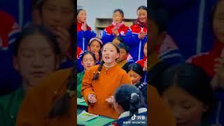 Tibetan students sing a song in the class