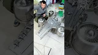 A Chinese man has created a miniature stainless steel model of an aircraft carrier.